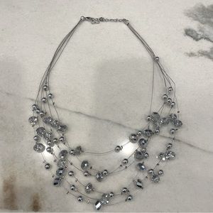 Sparkly 6 strand beaded necklace. 9 inch drop.